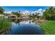 Scenic water view of home featuring docks and lush vegetation at 2571 Cyprus Dr # 1-105, Palm Harbor, FL 34684