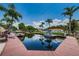 Scenic waterfront view of boat docks with palm trees creating a relaxing and tropical waterfront paradise at 2571 Cyprus Dr # 1-105, Palm Harbor, FL 34684