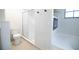 Clean bathroom with glass shower doors, toilet, and a modern electric fireplace at 2715 Willow Oaks Dr, Valrico, FL 33594