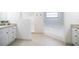 Bright bathroom featuring a walk-in shower, garden tub, and neutral tile floors at 2715 Willow Oaks Dr, Valrico, FL 33594
