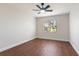 Bright bedroom with wood floors has a ceiling fan and natural light at 2715 Willow Oaks Dr, Valrico, FL 33594