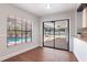 Bright dining room with a window overlooking the pool and sliding glass doors to the patio at 2715 Willow Oaks Dr, Valrico, FL 33594