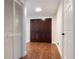 Inviting entryway featuring hardwood floors, double doors, and white walls at 2715 Willow Oaks Dr, Valrico, FL 33594