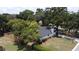 Aerial view of a beautiful home with a spacious yard and lush landscaping at 2715 Willow Oaks Dr, Valrico, FL 33594