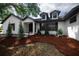 Beautiful brick home with black trim, dormer windows, and attractive landscaping enhances the curb appeal of this property at 2715 Willow Oaks Dr, Valrico, FL 33594