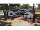 Charming white brick home featuring a well-manicured lawn and mature trees at 2715 Willow Oaks Dr, Valrico, FL 33594