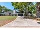 Exterior of a home with an attached two-car garage and long driveway at 2715 Willow Oaks Dr, Valrico, FL 33594