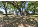 Lush, mature trees beautifully frame this charming home's exterior and yard space at 2715 Willow Oaks Dr, Valrico, FL 33594