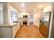 Bright, updated kitchen with stainless steel appliances, granite countertops, and modern finishes at 2715 Willow Oaks Dr, Valrico, FL 33594