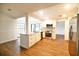 Bright, open kitchen features stainless steel appliances, granite countertops, and wood floors at 2715 Willow Oaks Dr, Valrico, FL 33594