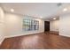 Inviting living room with beautiful hardwood floors, neutral walls, and ample natural light at 2715 Willow Oaks Dr, Valrico, FL 33594