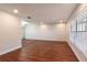Bright and airy living room featuring hardwood floors, neutral paint, and large windows at 2715 Willow Oaks Dr, Valrico, FL 33594