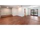 Open concept living room with hardwood floors, leading to the pool area through French doors at 2715 Willow Oaks Dr, Valrico, FL 33594