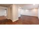 Open living space featuring hardwood floors, white walls, and closet space at 2715 Willow Oaks Dr, Valrico, FL 33594