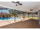 Relaxing screened-in pool area with overhead fans at 2715 Willow Oaks Dr, Valrico, FL 33594