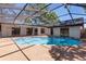 Inviting backyard with screened in pool and ample space for entertaining at 2715 Willow Oaks Dr, Valrico, FL 33594