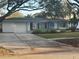 Inviting single-story home with a well-maintained lawn and attached one car garage at 287 Belleair Ne Dr, St Petersburg, FL 33704