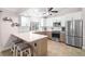 Contemporary kitchen featuring stainless steel appliances, a breakfast bar, and plenty of storage, great for culinary adventures at 304 Jean St, Palm Harbor, FL 34683