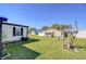 Lush backyard with green lawn offering privacy and relaxation at 3051 Shady Creek Dr, Wesley Chapel, FL 33543