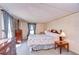 Relaxing bedroom with a large bed, dresser, and a side table for comfort and convenience at 3051 Shady Creek Dr, Wesley Chapel, FL 33543