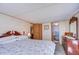 Spacious bedroom with a bed, dresser, and access to a bathroom at 3051 Shady Creek Dr, Wesley Chapel, FL 33543