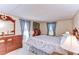 Comfortable bedroom featuring a dresser, and natural light from a window at 3051 Shady Creek Dr, Wesley Chapel, FL 33543