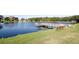 Scenic pond with a wooden pier at 3051 Shady Creek Dr, Wesley Chapel, FL 33543