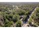 Aerial view of a home with sprawling grounds, surrounded by lush trees and greenery, providing ultimate privacy at 317 Old East Lake Rd, Tarpon Springs, FL 34688