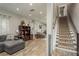 Spacious finished basement with hardwood floors, a large sectional couch, and recessed lighting at 317 Old East Lake Rd, Tarpon Springs, FL 34688
