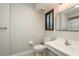 Bathroom offers a clean, bright space with essential amenities and neutral tones for a calming experience at 317 Old East Lake Rd, Tarpon Springs, FL 34688