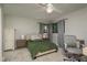 Bedroom with a bed, chair, and two windows at 317 Old East Lake Rd, Tarpon Springs, FL 34688