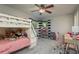 Bedroom with a bunk bed, shelves, and a desk at 317 Old East Lake Rd, Tarpon Springs, FL 34688