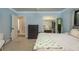 A spacious bedroom is enhanced by natural light, complemented by a dark dresser and convenient closet space at 317 Old East Lake Rd, Tarpon Springs, FL 34688