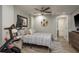 Bedroom with a bed, ceiling fan, and exercise equipment at 317 Old East Lake Rd, Tarpon Springs, FL 34688