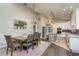Open concept kitchen and dining area with modern appliances, island, and ample counter space at 317 Old East Lake Rd, Tarpon Springs, FL 34688