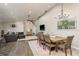 Open concept living space with high ceilings, stylish decor, hardwood floors, and comfortable seating area at 317 Old East Lake Rd, Tarpon Springs, FL 34688