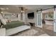 Spacious main bedroom suite with hardwood floors, and a modern ensuite bathroom at 317 Old East Lake Rd, Tarpon Springs, FL 34688