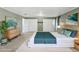 Bedroom with art, closet, bed, and nightstand at 3346 Bainbridge Dr, Holiday, FL 34691