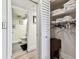 Bright bathroom boasts modern fixtures, wood-look floors, and convenient closet storage with folding table at 36750 Us 19 N # 17106, Palm Harbor, FL 34684