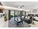 A spacious bedroom and sitting area with access to outdoor seating and patio space at 36750 Us 19 N # 17106, Palm Harbor, FL 34684