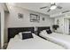 Bright bedroom with two beds, ceiling fan, and gray walls at 36750 Us 19 N # 17106, Palm Harbor, FL 34684
