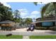 Loch Ness Monster Pool with recreational vehicles, blue skies and beautiful vegetation at 36750 Us 19 N # 17106, Palm Harbor, FL 34684