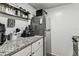 Granite countertops, stainless steel appliances, and modern fixtures in the kitchen area at 36750 Us 19 N # 17106, Palm Harbor, FL 34684
