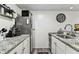 Efficient kitchen featuring granite countertops, stainless steel appliances, and ample storage at 36750 Us 19 N # 17106, Palm Harbor, FL 34684