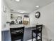 Cozy kitchenette with granite countertops, seating for two, and stainless steel appliances at 36750 Us 19 N # 17106, Palm Harbor, FL 34684