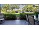 Cozy patio with outdoor seating overlooking a lush green space and parking area at 36750 Us 19 N # 17106, Palm Harbor, FL 34684