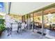 Charming patio with outdoor seating and a seamless transition to indoor living space through sliding doors at 36750 Us 19 N # 17106, Palm Harbor, FL 34684
