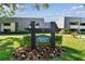 Well-maintained property grounds with sign displaying address in front of condos at 36750 Us 19 N # 17106, Palm Harbor, FL 34684