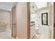 Bright bathroom features a white vanity with granite countertop and a large mirror at 36750 Us 19 N # 22207, Palm Harbor, FL 34684