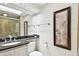 Tasteful bathroom features a tiled shower, vanity with granite countertop, and decorative wall art at 36750 Us 19 N # 22207, Palm Harbor, FL 34684